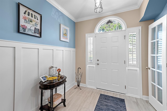 2761 Kruzel St Unit H, Myrtle Beach, SC 29577 - entrance foyer featuring ornamental molding, wainscoting, and a decorative wall