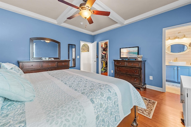 2761 Kruzel St Unit H, Myrtle Beach, SC 29577 - bedroom with a spacious closet, beam ceiling, wood finished floors, a closet, and ornamental molding