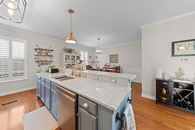 2761 Kruzel St Unit H, Myrtle Beach, SC 29577 - kitchen with dishwasher, ornamental molding, gray cabinets, light wood-type flooring, and pendant lighting