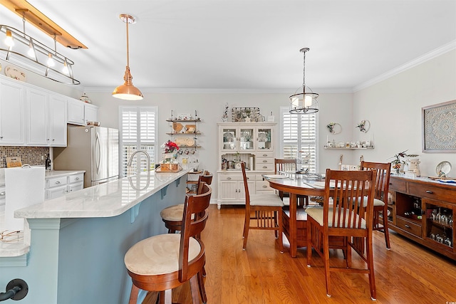 2761 Kruzel St Unit H, Myrtle Beach, SC 29577 - dining area with ornamental molding and light wood-type flooring