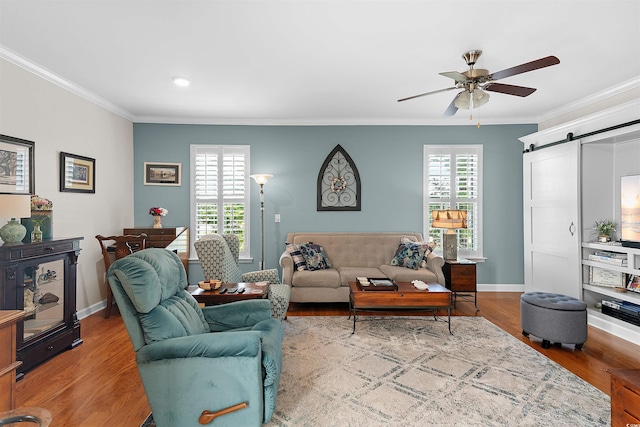 2761 Kruzel St Unit H, Myrtle Beach, SC 29577 - living room featuring a barn door, crown molding, a ceiling fan, wood finished floors, and recessed lighting