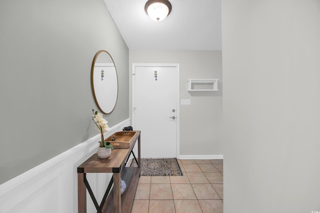 10301 N Kings Hwy Unit 21-4, Myrtle Beach, SC 29572 - entrance foyer featuring light tile patterned flooring and a textured ceiling
