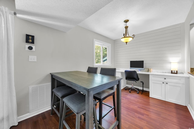 10301 N Kings Hwy Unit 21-4, Myrtle Beach, SC 29572 - dining room featuring dark wood finished floors, a textured ceiling, an office area, and vaulted ceiling
