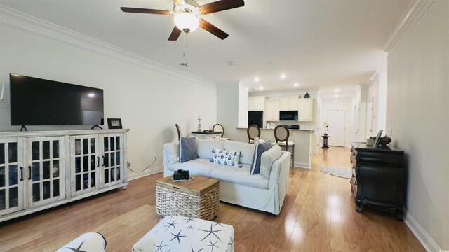 130 Puffin Dr Unit 2B, Pawleys Island, SC 29585 - living room featuring crown molding, ceiling fan, light wood-type flooring, and recessed lighting