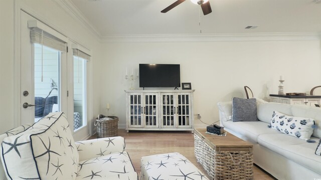 130 Puffin Dr Unit 2B, Pawleys Island, SC 29585 - living area with crown molding, ceiling fan, and wood finished floors