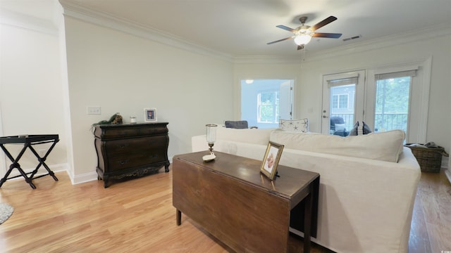 130 Puffin Dr Unit 2B, Pawleys Island, SC 29585 - living area with light wood-type flooring, ceiling fan, and crown molding