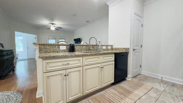 130 Puffin Dr Unit 2B, Pawleys Island, SC 29585 - kitchen featuring cream cabinetry, dishwasher, ceiling fan, a peninsula, and light stone counters