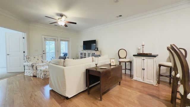 130 Puffin Dr Unit 2B, Pawleys Island, SC 29585 - living room with light wood-style floors, ceiling fan, and crown molding