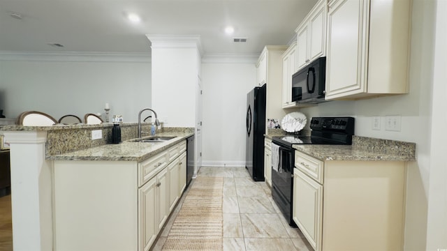130 Puffin Dr Unit 2B, Pawleys Island, SC 29585 - kitchen featuring black appliances, crown molding, a peninsula, light stone countertops, and a kitchen breakfast bar