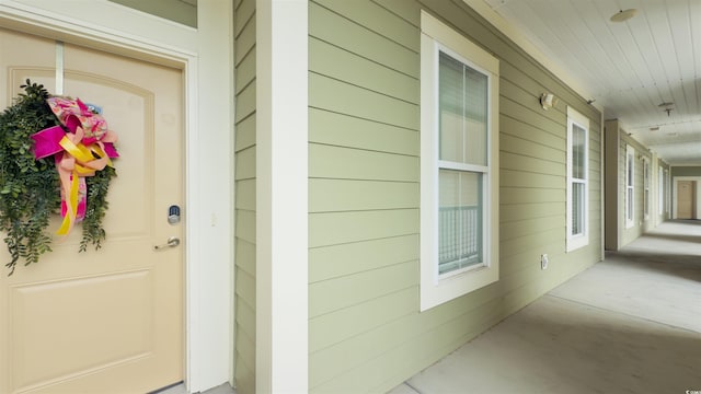 130 Puffin Dr Unit 2B, Pawleys Island, SC 29585 - view of exterior entry with covered porch