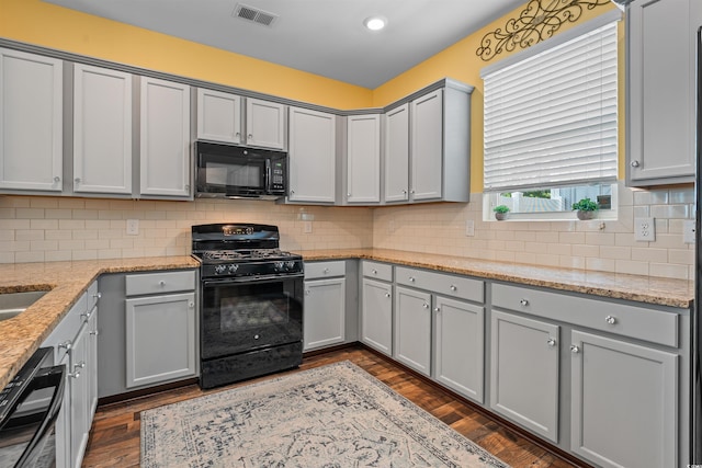 2384 Heritage Loop Unit 2384, Myrtle Beach, SC 29577 - kitchen with black appliances, gray cabinets, light stone countertops, decorative backsplash, and recessed lighting