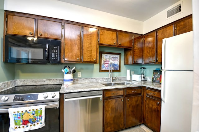 200 S Ocean Blvd Unit 3-B, North Myrtle Beach, SC 29582 - kitchen with stainless steel appliances and light stone counters