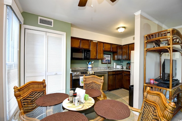 200 S Ocean Blvd Unit 3-B, North Myrtle Beach, SC 29582 - kitchen featuring appliances with stainless steel finishes, ceiling fan, light tile patterned floors, light countertops, and crown molding