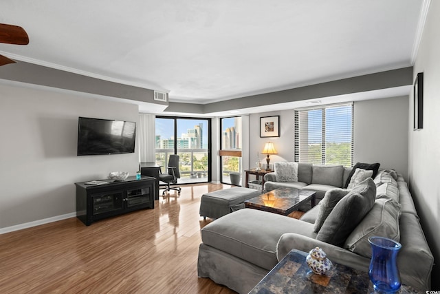 400 20th Ave N Unit 606, Myrtle Beach, SC 29577 - living room featuring crown molding, healthy amount of natural light, and wood finished floors