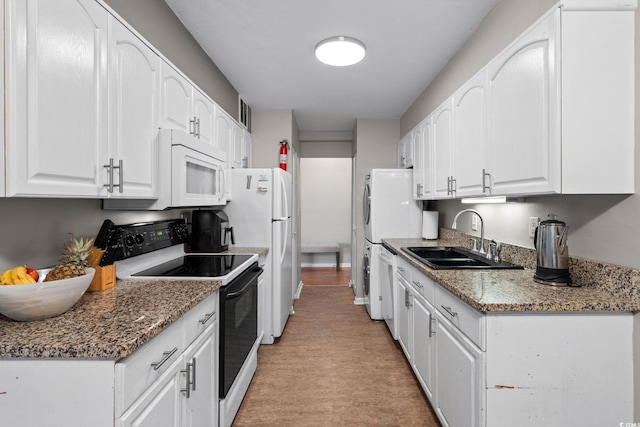 400 20th Ave N Unit 606, Myrtle Beach, SC 29577 - kitchen with white appliances, white cabinets, and stone countertops