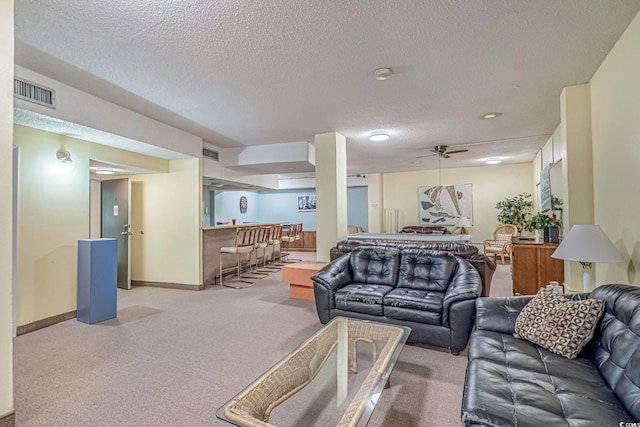 400 20th Ave N Unit 606, Myrtle Beach, SC 29577 - living room with bar, carpet, a textured ceiling, and ceiling fan