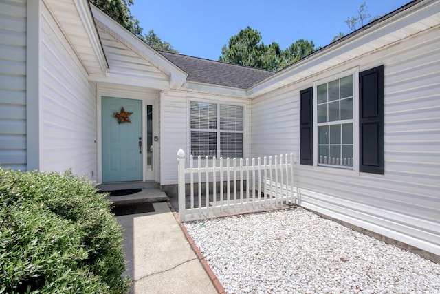 23 Robert Conway Ct, Georgetown, SC 29440 - doorway to property with roof with shingles
