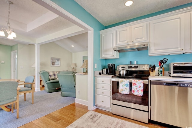 23 Robert Conway Ct, Georgetown, SC 29440 - kitchen with appliances with stainless steel finishes, under cabinet range hood, light wood finished floors, a chandelier, and white cabinets