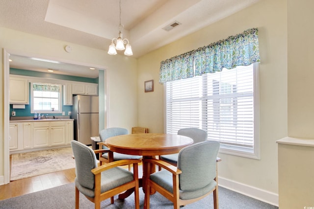 23 Robert Conway Ct, Georgetown, SC 29440 - dining area featuring a chandelier and wood finished floors