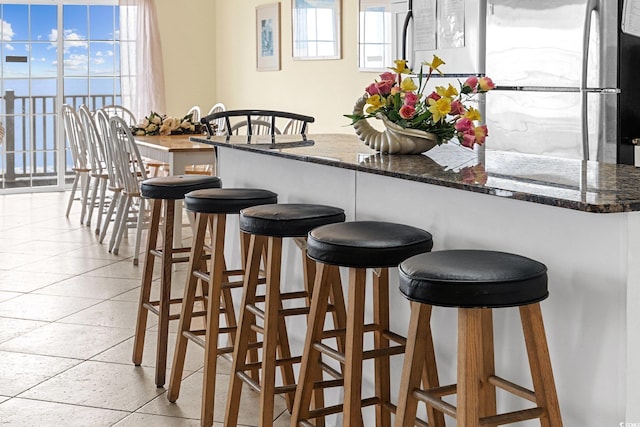 817 S Ocean Blvd Unit 201, North Myrtle Beach, SC 29582 - bar area with freestanding refrigerator