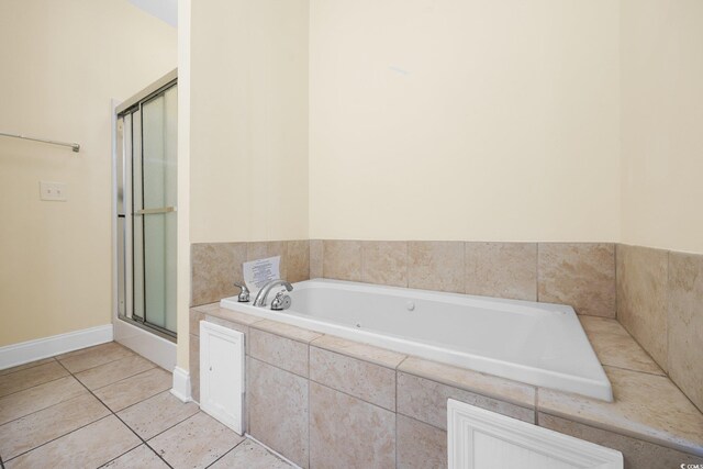 817 S Ocean Blvd Unit 201, North Myrtle Beach, SC 29582 - full bath featuring a garden tub, a shower with shower door, and tile patterned flooring