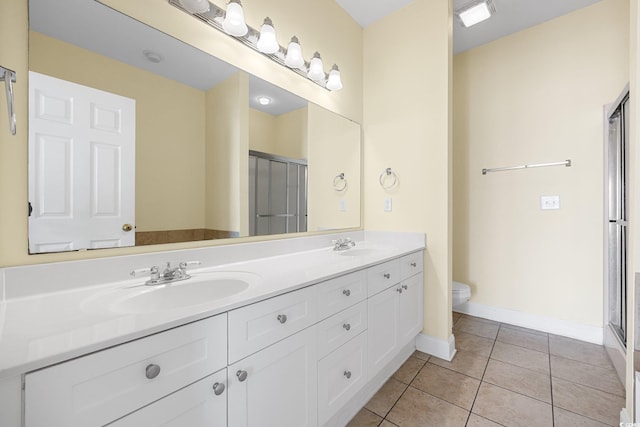 817 S Ocean Blvd Unit 201, North Myrtle Beach, SC 29582 - full bathroom with double vanity, tile patterned floors, and a shower stall