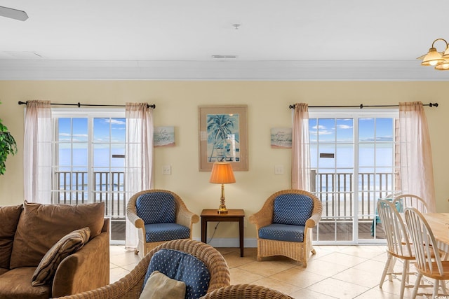 817 S Ocean Blvd Unit 201, North Myrtle Beach, SC 29582 - living area with crown molding, light tile patterned floors, and healthy amount of natural light