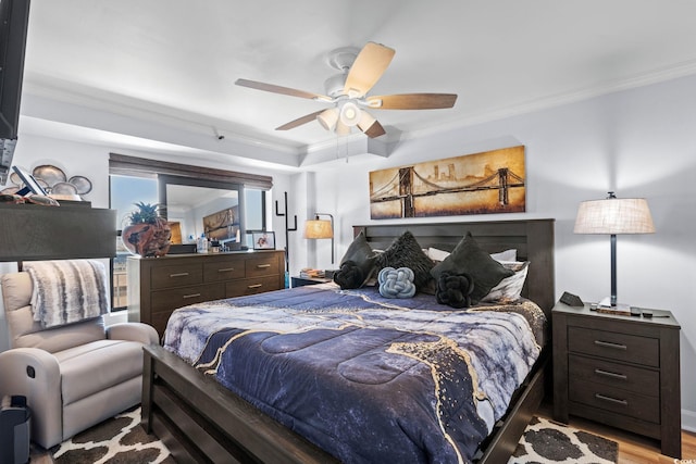 5511 N Ocean Blvd Unit 902, Myrtle Beach, SC 29577 - bedroom with ornamental molding, a ceiling fan, and wood finished floors