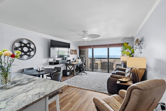 5511 N Ocean Blvd Unit 902, Myrtle Beach, SC 29577 - living room with ornamental molding, wood finished floors, ceiling fan, beverage cooler, and a desk