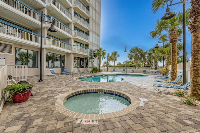 5511 N Ocean Blvd Unit 902, Myrtle Beach, SC 29577 - community pool with a hot tub and a patio area