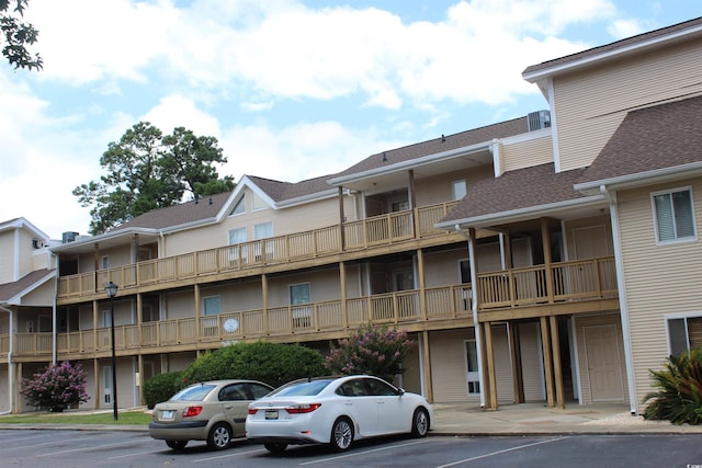 1025 Plantation Dr W Unit 2625/2626, Little River, SC 29566 - view of building exterior with uncovered parking