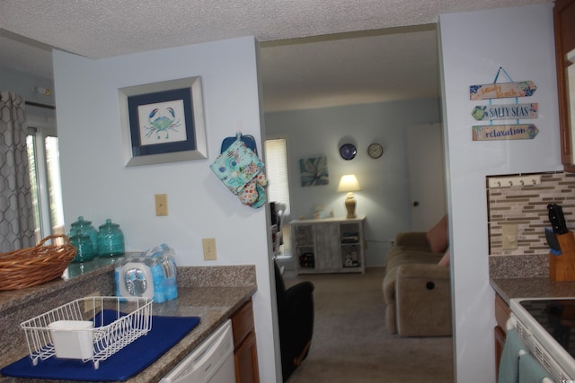 1025 Plantation Dr W Unit 2625/2626, Little River, SC 29566 - kitchen with carpet floors, white appliances, and decorative backsplash