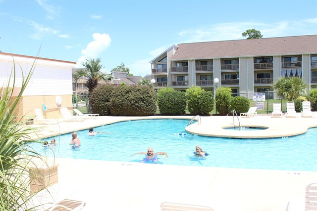 1025 Plantation Dr W Unit 2625/2626, Little River, SC 29566 - community pool featuring a community hot tub and a patio