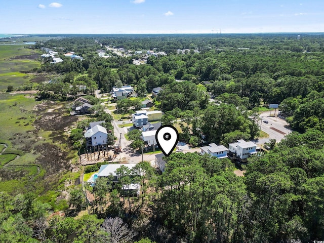 196 Brown Pelican Loop, Pawleys Island, SC 29585 - aerial view of property's location featuring a heavily wooded area