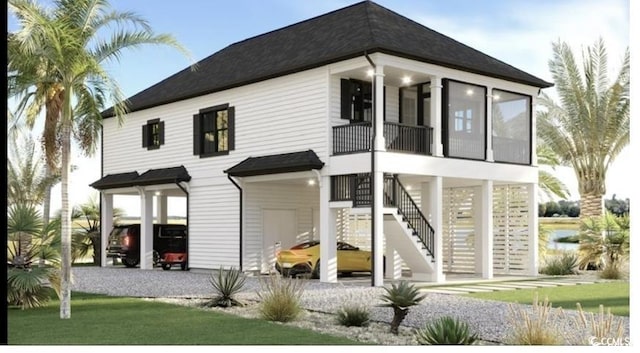 196 Brown Pelican Loop, Pawleys Island, SC 29585 - back of property with a balcony, stairs, and roof with shingles