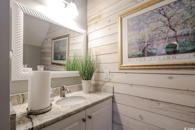 417 Pennington Loop, Myrtle Beach, SC 29588 - bathroom featuring wooden walls, vanity, and vaulted ceiling