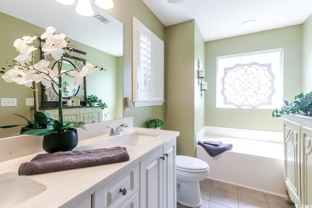 417 Pennington Loop, Myrtle Beach, SC 29588 - bathroom with double vanity, a garden tub, and tile patterned floors