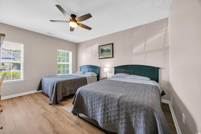4502 Ailsa Ct Unit B, Conway, SC 29526 - bedroom featuring multiple windows, wood finished floors, and ceiling fan