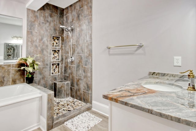 2180 Waterview Dr Unit 721, North Myrtle Beach, SC 29582 - bathroom with a tile shower, vanity, a garden tub, and wood finished floors