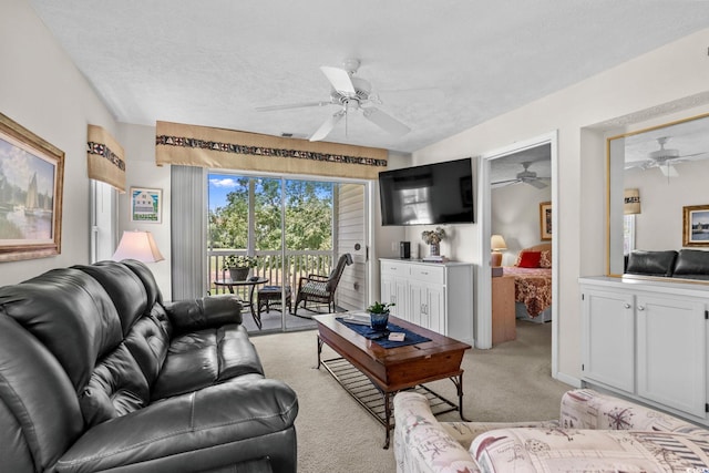 493 White River Dr Unit 28-D, Myrtle Beach, SC 29579 - living room featuring a ceiling fan, light colored carpet, and a textured ceiling