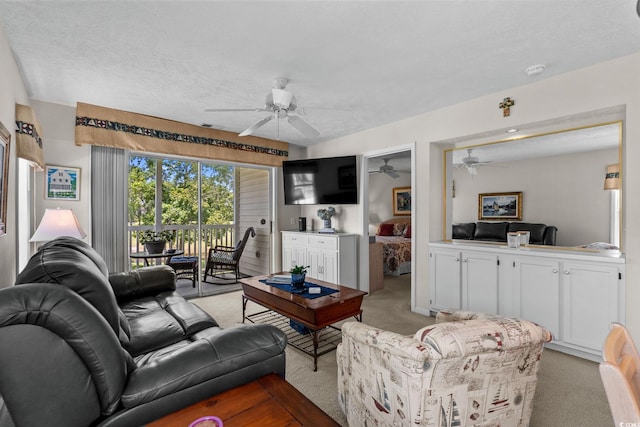 493 White River Dr Unit 28-D, Myrtle Beach, SC 29579 - living area with light colored carpet, a ceiling fan, and a textured ceiling