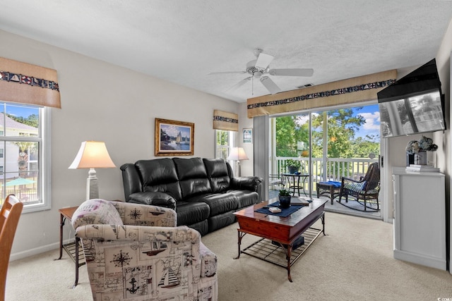 493 White River Dr Unit 28-D, Myrtle Beach, SC 29579 - living area featuring light carpet, a ceiling fan, and a textured ceiling