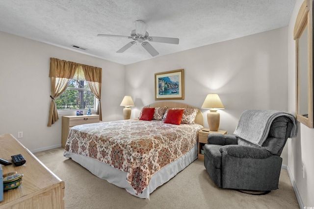 493 White River Dr Unit 28-D, Myrtle Beach, SC 29579 - bedroom with light colored carpet, a textured ceiling, and a ceiling fan