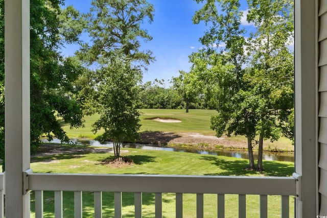 493 White River Dr Unit 28-D, Myrtle Beach, SC 29579 - view of grassy yard with a water view, golf course view, view of wooded area, and a balcony