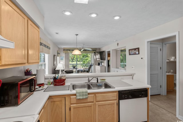 493 White River Dr Unit 28-D, Myrtle Beach, SC 29579 - kitchen featuring white dishwasher, black microwave, recessed lighting, light countertops, and a peninsula