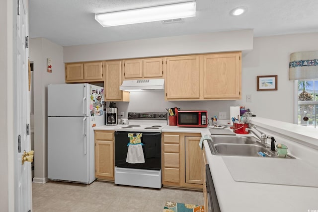 493 White River Dr Unit 28-D, Myrtle Beach, SC 29579 - kitchen with white appliances, light brown cabinets, under cabinet range hood, light countertops, and recessed lighting