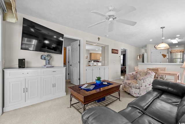 493 White River Dr Unit 28-D, Myrtle Beach, SC 29579 - living area with light colored carpet, ceiling fan, and recessed lighting