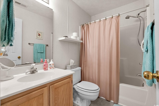 493 White River Dr Unit 28-D, Myrtle Beach, SC 29579 - bathroom with vanity, shower / bath combo, a textured ceiling, and tile patterned flooring