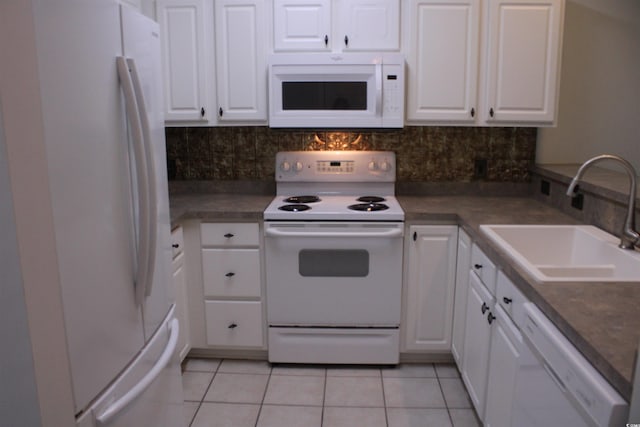 134 Scotch Broom Dr Unit K-203, Little River, SC 29566 - kitchen featuring white appliances, light tile patterned floors, and white cabinetry