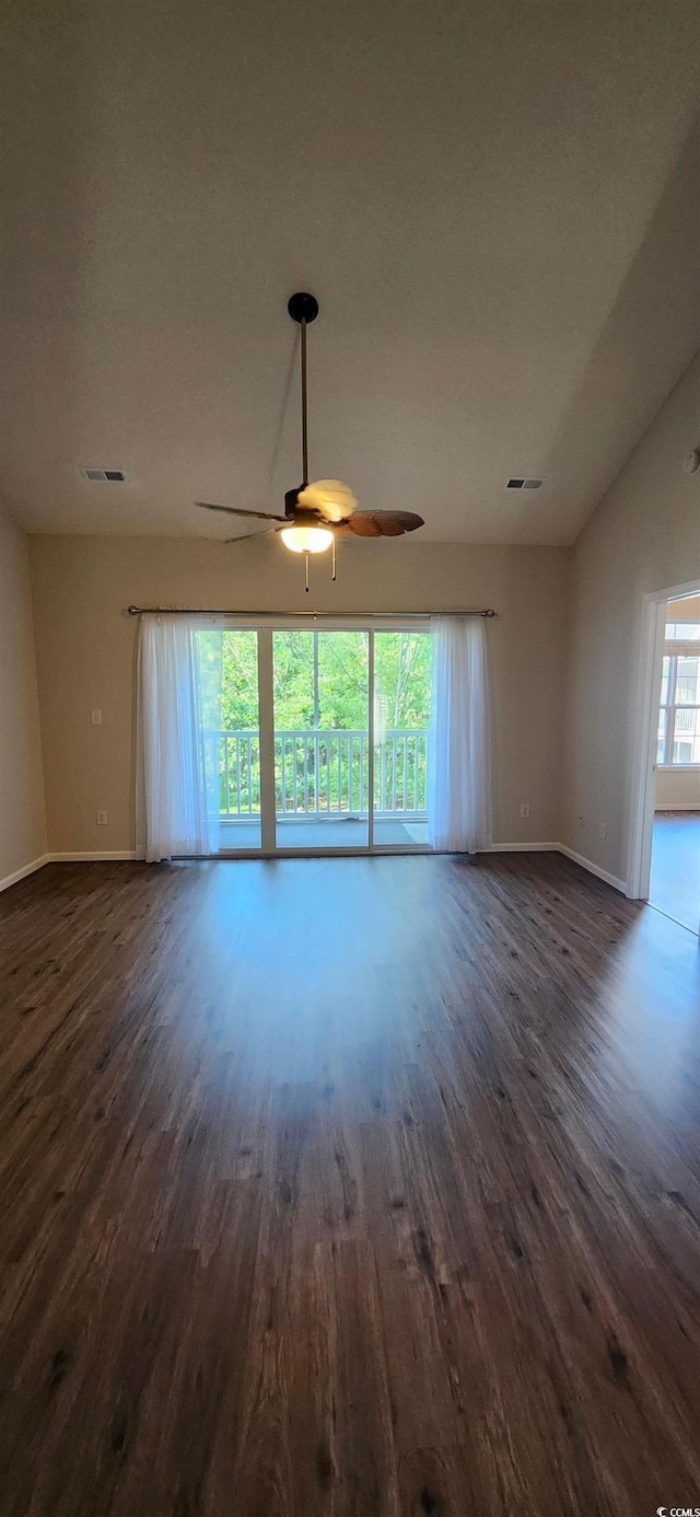 134 Scotch Broom Dr Unit K-203, Little River, SC 29566 - unfurnished living room featuring dark wood-type flooring, ceiling fan, and vaulted ceiling